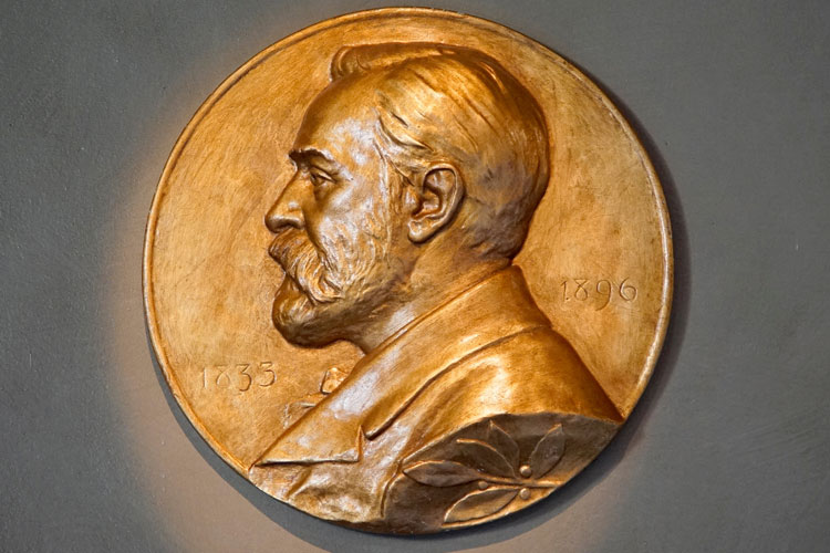 Bronze medallion with inscription featuring bust of Alfred Nobel